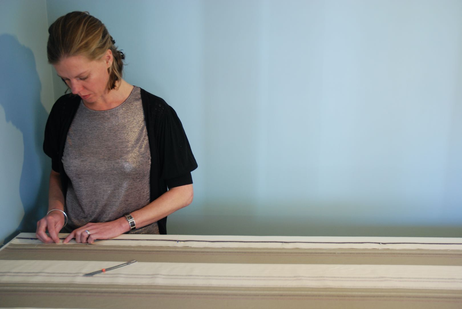 Natasha sewing in her workshop